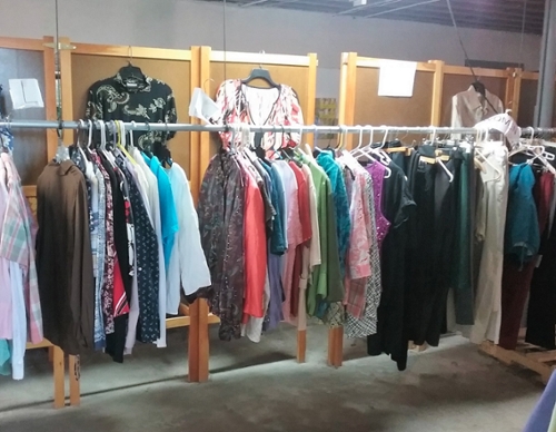 photo of shirts hanging on a rach
